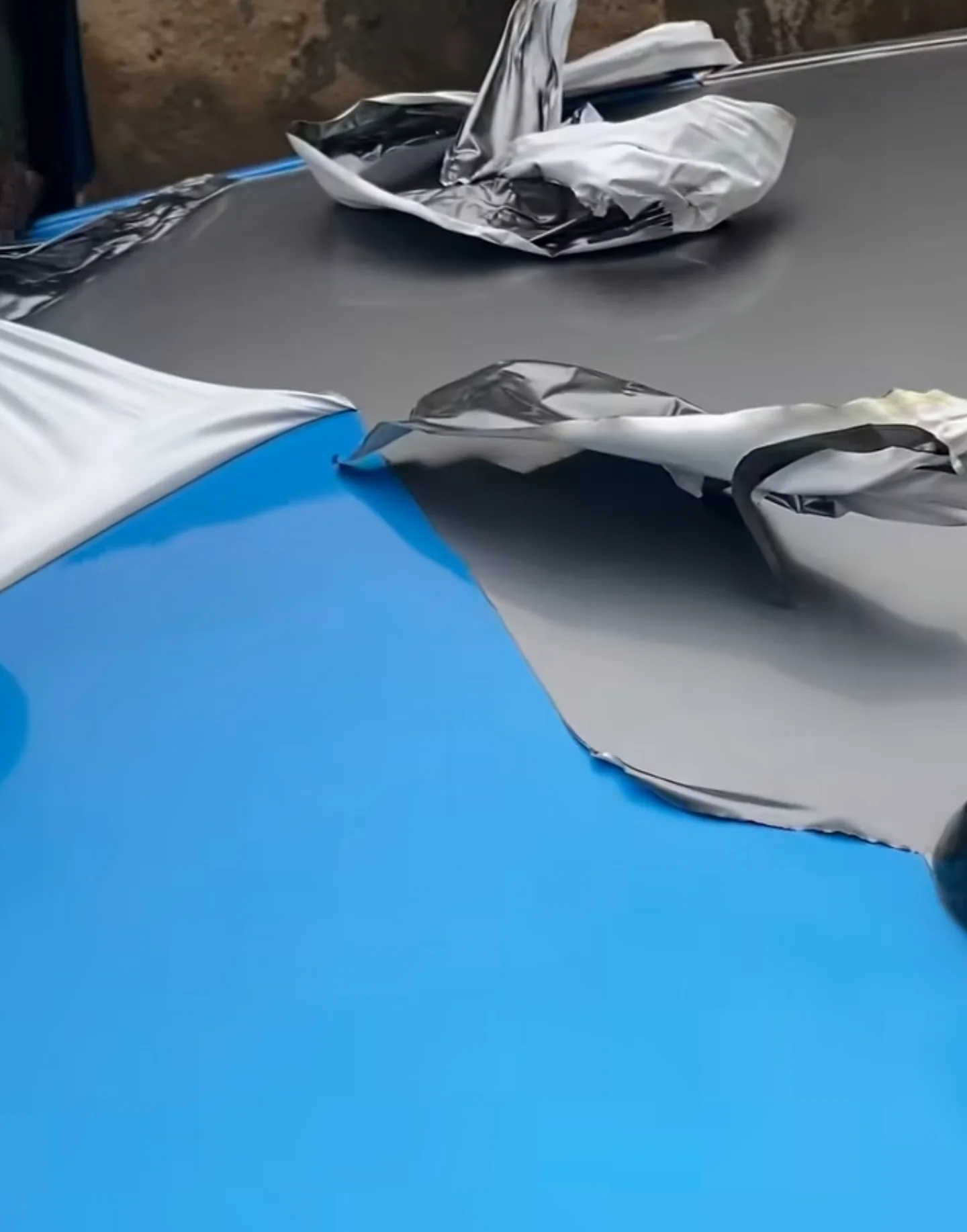 Dodge Charger bonnet with 2-year silver wrap removed revealing perfect factory paint underneath