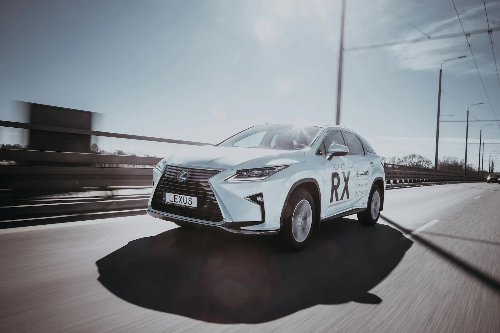 Lexus IS350 sedan exterior white on highway wrap potential Nigeria