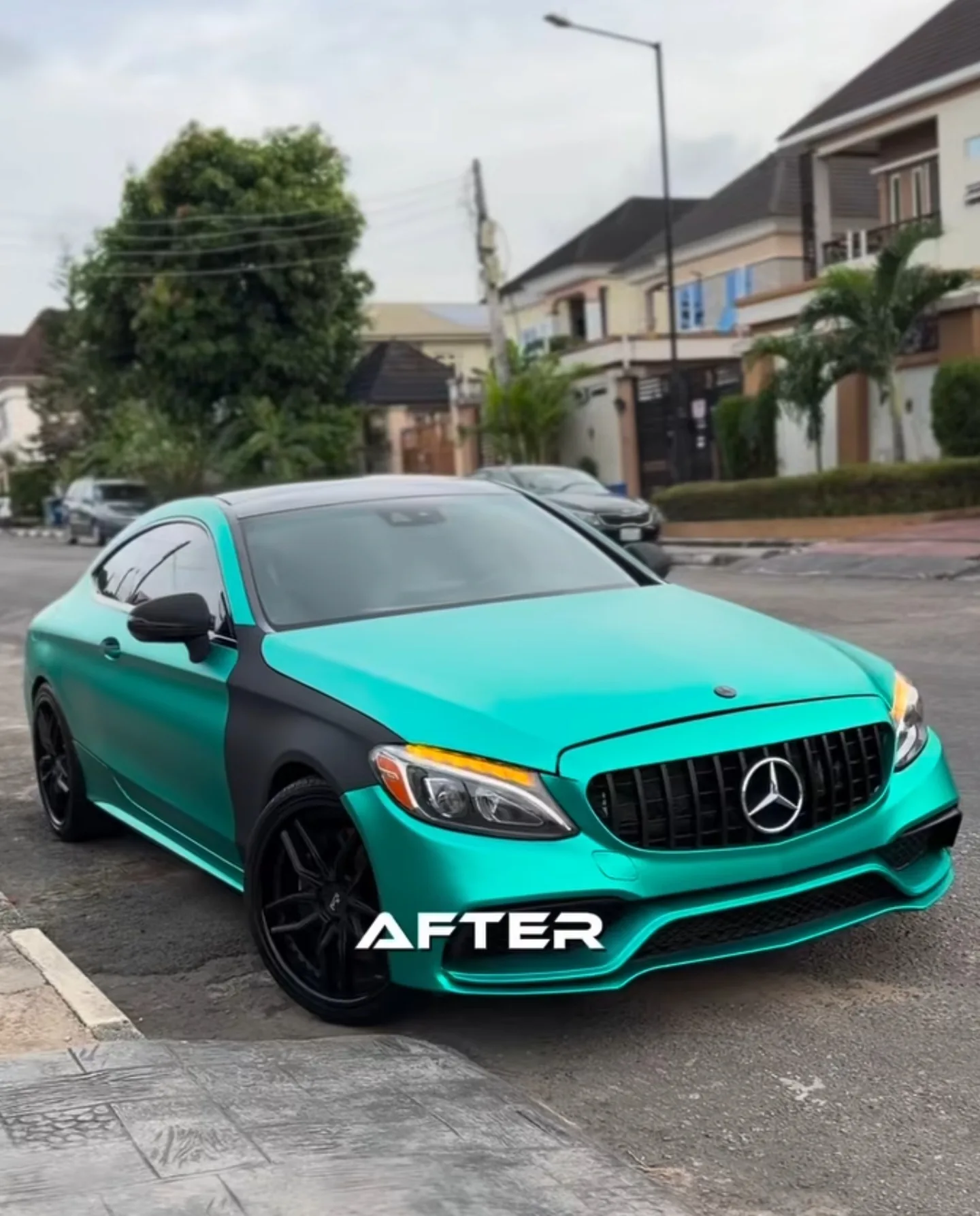 Mercedes C43 AMG satin aqua green matte black two-tone wrap complete front view after transformation Lagos